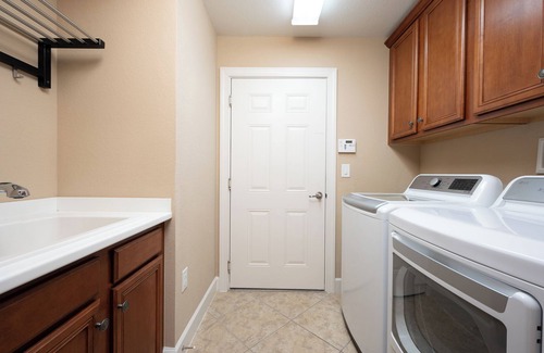 Naples House | Golf/Lake View 2 Bed+Den Coach Home In Amenity Rich Community, the Quarry!