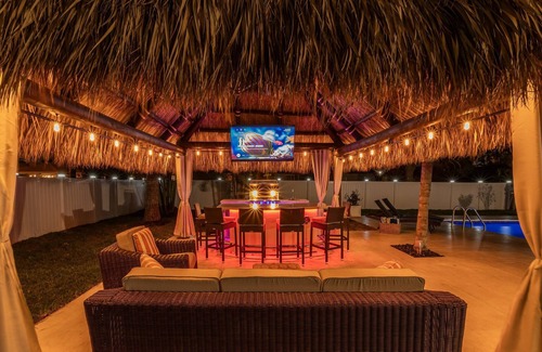 Boynton Beach House | Golfers Green Retreat with 35' Heated Pool & Tiki. Pet Friendly!