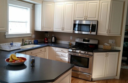 Warrensburg House | GORGEOUS AND MODERN describes this 6 bedroom home .