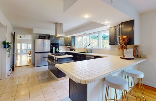 Gardiner House | Gorgeous home with fireplaces, skylights, jetted tubs, library & home gym