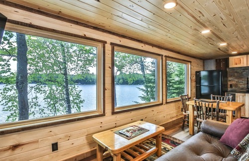 St Germain House | Gorgeous remodeled lakeside cabin with fireplace, personal dock, and sandy beach