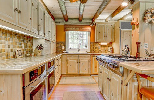 Trout Lake House | Gorgeous Riverfront Home & Guesthouse with Deck, Firepits & Media Room
