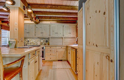 Trout Lake House | Gorgeous Riverfront Home & Guesthouse with Deck, Firepits & Media Room
