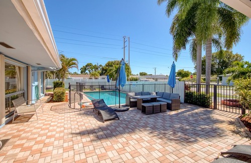 Coral Ridge Isles Apartment | Gorgeous & sun-soaked oasis with pool, furnished patio, generous yard, & AC