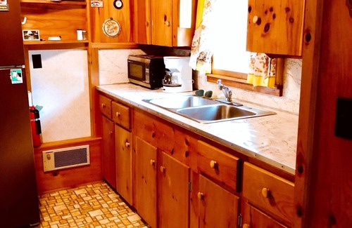Acton Cottage | Great East Lake cottage across camp road to a large sandy shared beach. View2NH!
