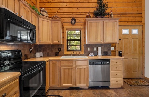 Branson Theater District Cabin | Great Family Cedar Cabin with Fireplace & Screened Deck just Minutes from Shows!