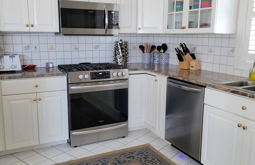 South End Condo | Great Summer Getaway! Steps to Beach, Ocean views and large wraparound deck