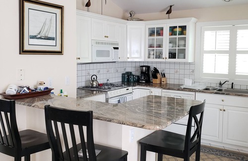 South End Condo | Great Summer Getaway! Steps to Beach, Ocean views and large wraparound deck