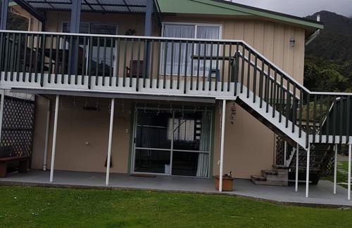 Okiwi Bay House | Great views from this double storey bach. Very close to sandy beach.