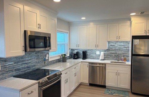 Englewood Condo | Ground floor Bay front, heated pool, dock, private beach access onsite.n