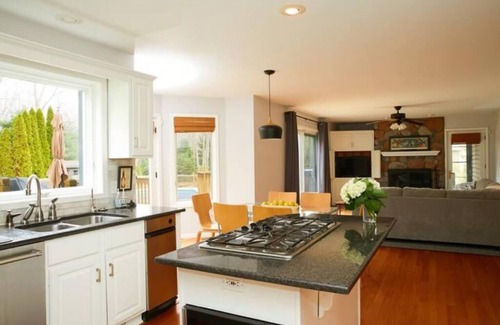 Stevensville House | Guest favorite! Quiet, wooded setting w/heated pool, hot tub, fire pit & more!