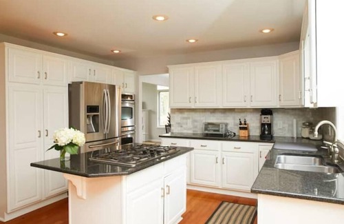 Stevensville House | Guest favorite! Quiet, wooded setting w/heated pool, hot tub, fire pit & more!