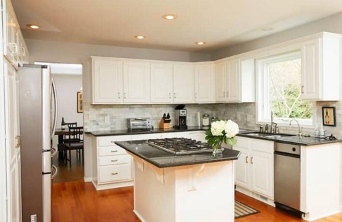 Stevensville House | Guest favorite! Quiet, wooded setting w/heated pool, hot tub, fire pit & more!