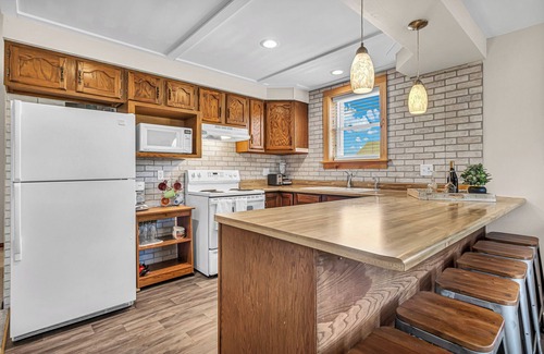 Elkhart Lake Condo | Heart of the Action, Village Square Upper Condo Sleeps 8
