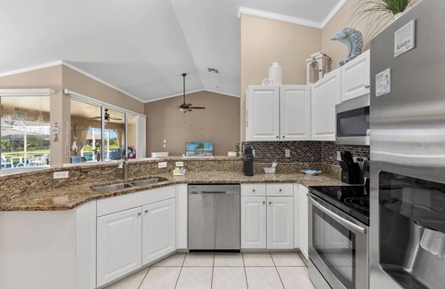 Trafalgar House | Heated Pool Plus Game Room on Fresh Water Canal