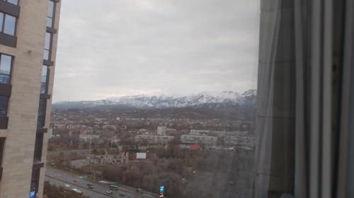 Almaty Apartment | Heavenly Comfort with Mountain View