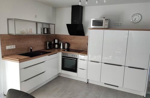 Hilgenriedersiel House | High-quality 100sqm vacation home for 6 people with fireplace and garden directly on the dike