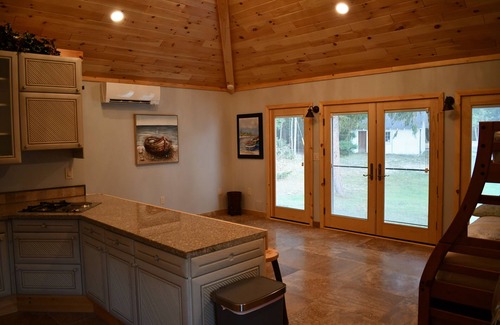 Higgins Lake House | Higgins Lake frontage Small Guest House With Shared Beach, Yard and Dock.
