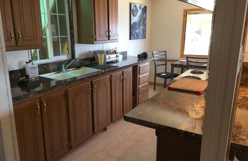 Wofford Heights Cabin | High on a mountainside with a hot tub on a deck.