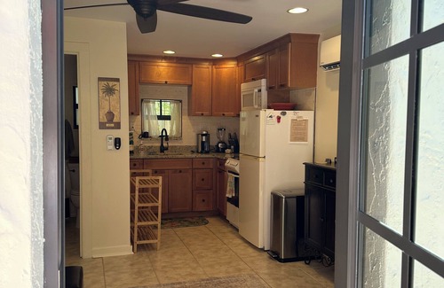 Poiciana Park II Cottage | Historic charm meets modern comfort—your cozy stay for work or play.