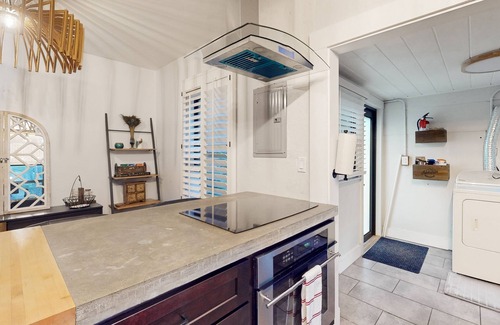 Poinciana Park House | Historic home in great locale with shared sauna, Ping-Pong, mini-golf, & grill