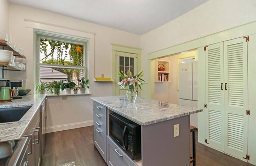 Racine House | Historic house on tree lined red brick street of historic homes.