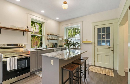 Racine House | Historic house on tree lined red brick street of historic homes.