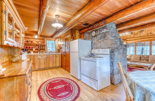 Mount Hood Village Cabin | Historic riverfront Steiner cabin in forest with firepit, deck, & patio lounging