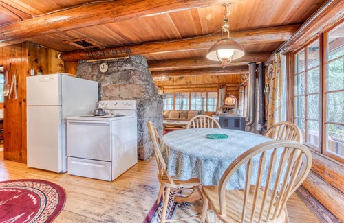 Mount Hood Village Cabin | Historic riverfront Steiner cabin in forest with firepit, deck, & patio lounging