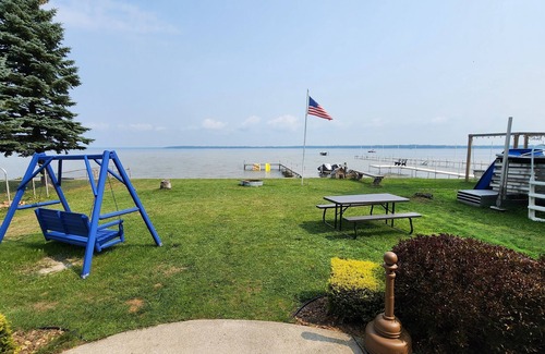 Prudenville House | HL - Beautiful LAKEFRONT Home - right by the sandbar everyone hangs at!