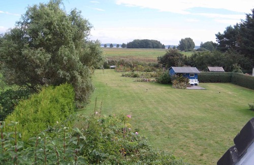 Dandorf Apartment | Holiday apartment with balcony, water view and garden