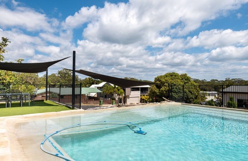 Rainbow Beach House | Holiday family, pet friendly home near the beach with a feature pool