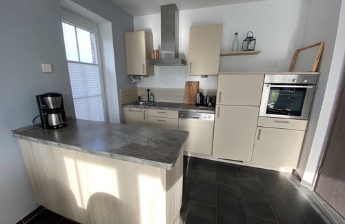 Fehmarn House | Holiday Home 'Haus Am Dorfteich D Mit Spielplatz' with Private Terrace, Shared Garden and Wi-Fi