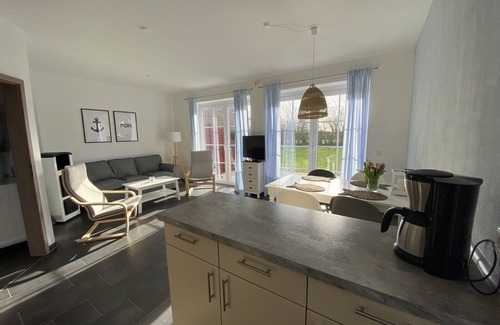 Fehmarn House | Holiday Home 'Haus Am Dorfteich D Mit Spielplatz' with Private Terrace, Shared Garden and Wi-Fi