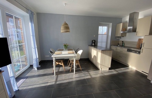 Fehmarn House | Holiday Home 'Haus Am Dorfteich D Mit Spielplatz' with Private Terrace, Shared Garden and Wi-Fi