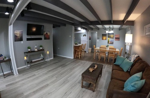 Eddyville House | Holiday House (Sleeps 1-12) - Offer a 4-bedroom, 2-bath unit with 1 queen, 3 full, 4 twin beds, and a pull-out sofa.