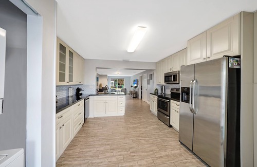 Melaleuca Gardens House | Home on Canal Unit B by PMI