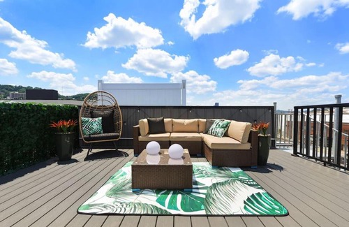 Lower Lawrenceville House | HostWise Stays - The Charlotte - Rooftop patio, Garage Parking, Prime Location, Large 3 Story Home