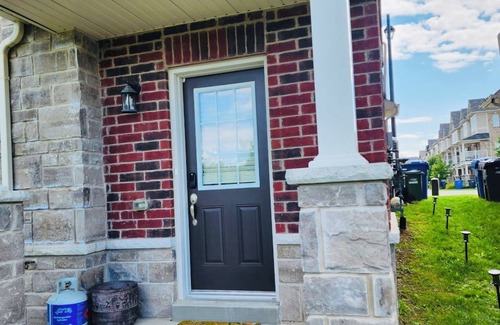 Guelph House | Hotel style private main level if townhome
