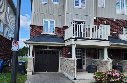 Guelph House | Hotel style private main level if townhome