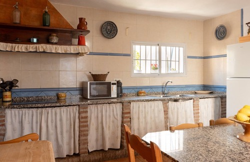 Alora Cottage | House cited in an environment of vegetation, very communicated with its surroundings