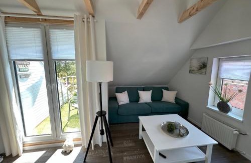 Reithamm Apartment | Huus an`t Koornfeld Dachgeschosswohnung mit Loggia