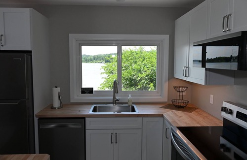 Lake Leelanau Cottage | IDEAL LOCATION @ THE NARROWS ON SOUTH LAKE LEELANAU W/DOCK.nPerfect Sunsets