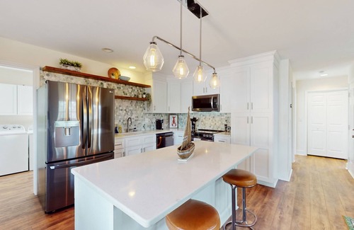 Hampstead House | Idyllic retreat with surfboards, hot tub, open layout, & firepit - dog-friendly
