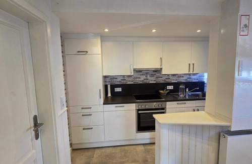 Dornumergrode Apartment | In a quiet residential area + fenced garden + free WiFi + by the sea + dogs welcome + modern furnishings
