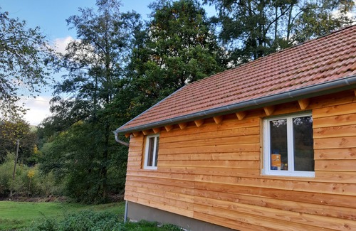 Biebergemund House | In the middle of nature, wooden house on the edge of the forest with a view of meadows and fields