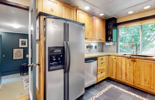 Lake Grove House | Inviting home with enclosed yard, firepit, hot tub, hammock, washer/dryer