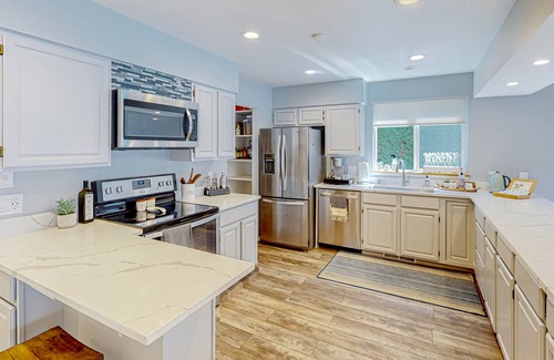 Big Lake House | Inviting lakefront home with hot tub, game room, dock, kayaks, pool table, & W/D