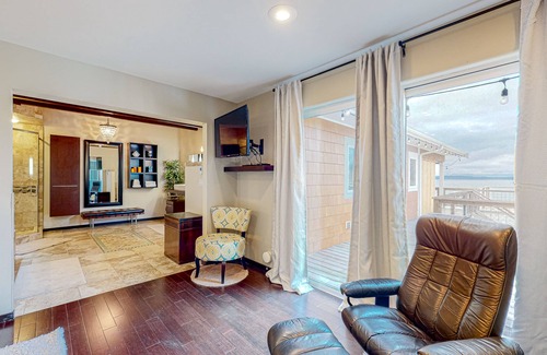 Clinton House | Inviting Puget Sound view home with beach access, fire table, hot tub, & W/D