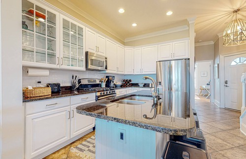 Waters Edge House | Inviting waterfront townhouse with beach access, balcony, W/D, pool & dock